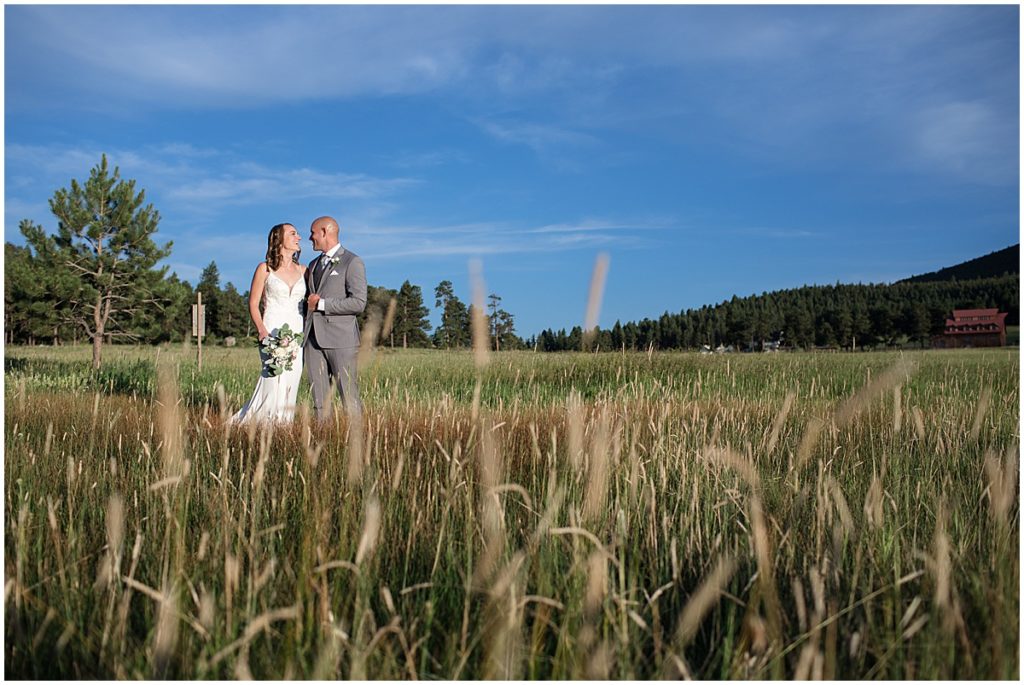 Bride and groom walking outside after elopement at Three Sisters Park in Evergreen