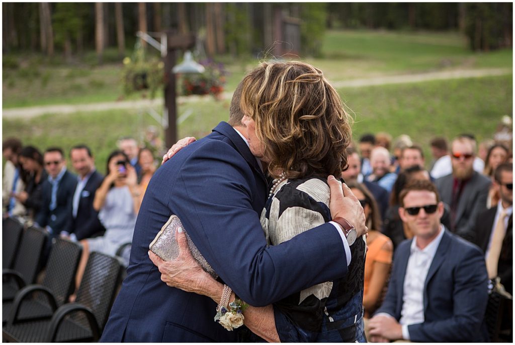 Mom and son hug before wedding at 10 mile station in Breckenridge