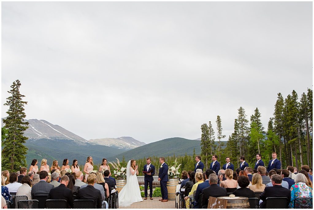 Bride and groom outside for wedding ceremony at 10 mile station in Breckenridge