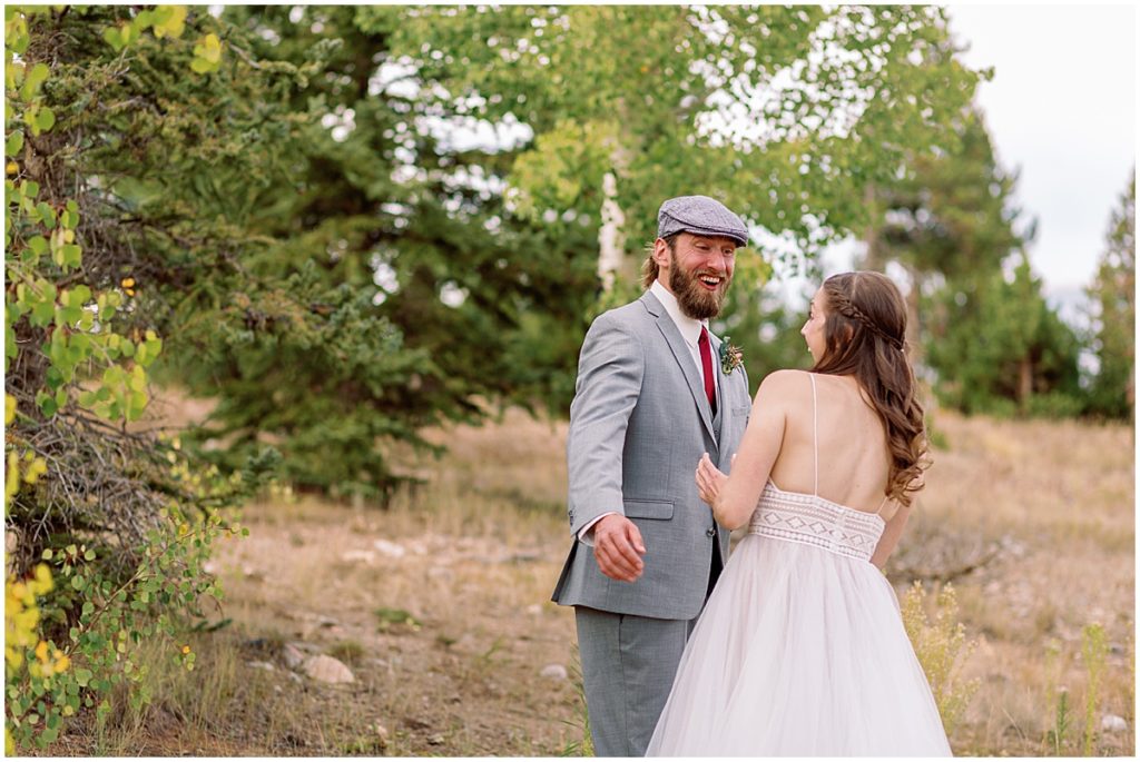 Bride and groom see each other for the first time for first look at Frisco Day Lodge