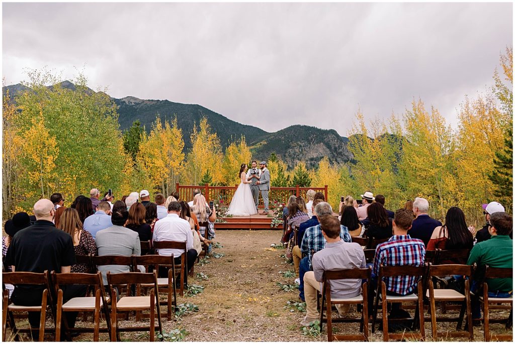 Guests viewing wedding ceremony at Frisco Day Lodge