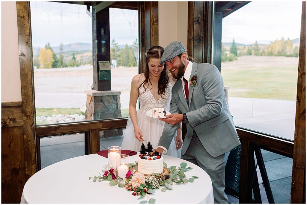 Bride and groom cutting wedding cake at Frisco Day Lodge