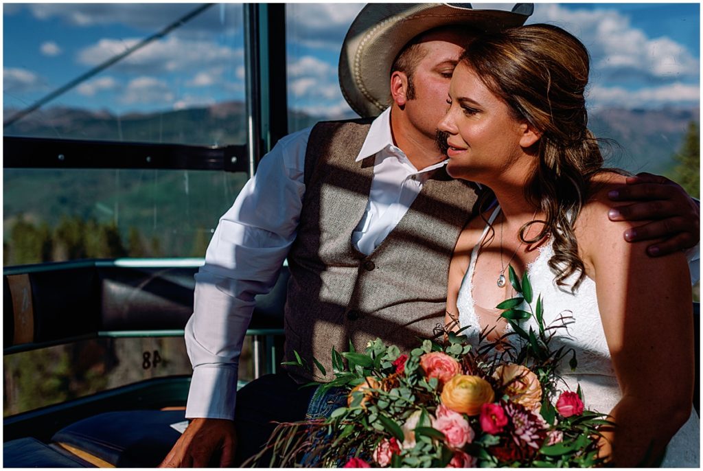 Bride and groom going on gondola for wedding at The Holy Cross Overlook in Vail