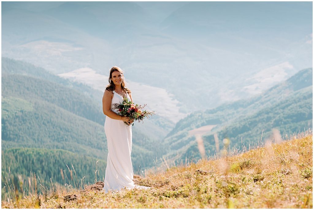 Bride at top of The Holy Cross Overlook in Vail