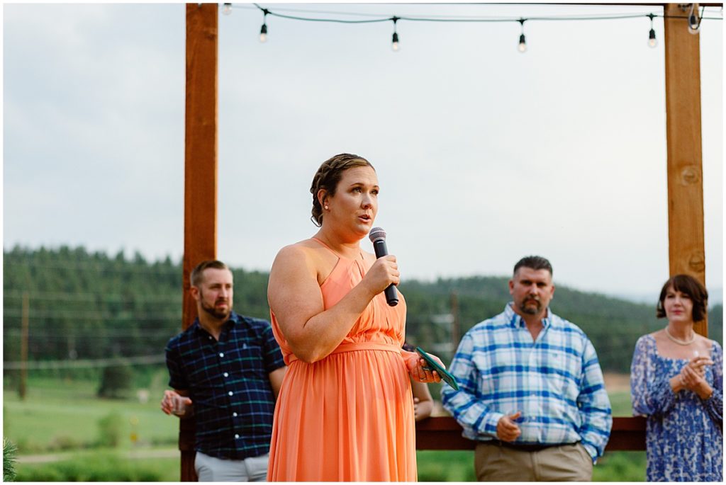 Bridesmaid giving speech outside at Deer Creek Valley Ranch