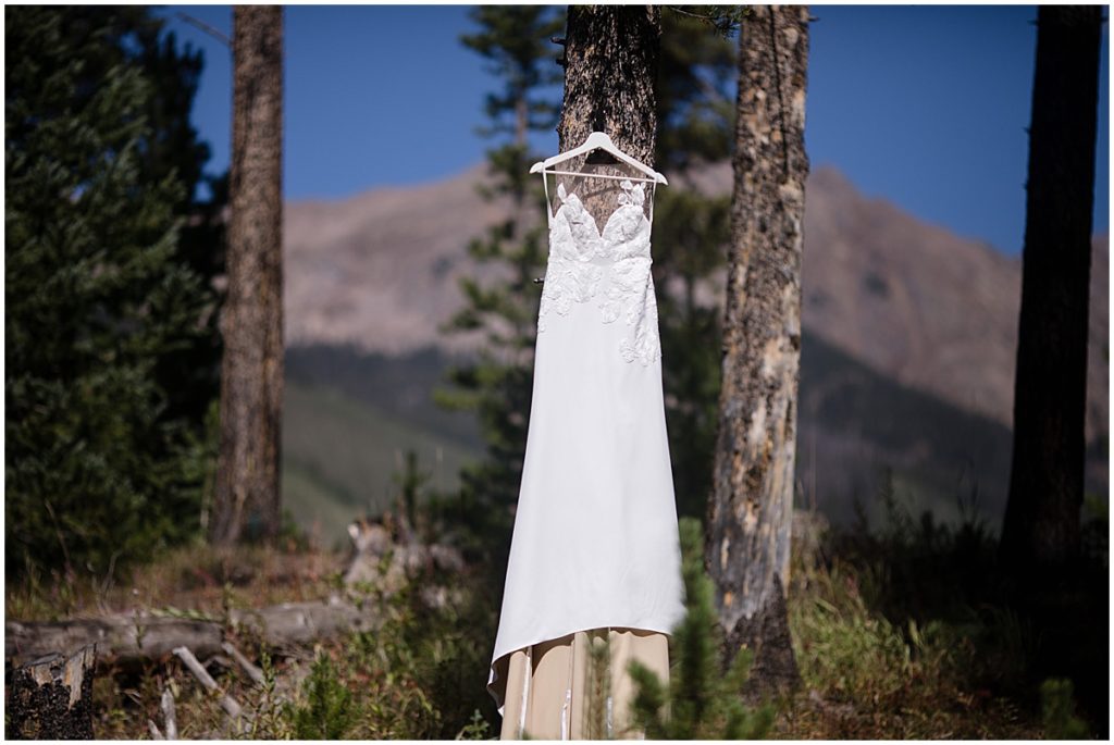 Bride wedding gown hanging outside at Piney River Ranch in Vail