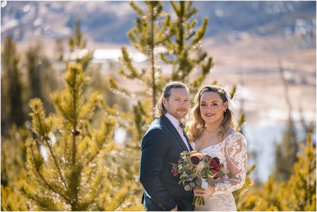 Bride and groom outside on Arapahoe Basin mountain after ceremony