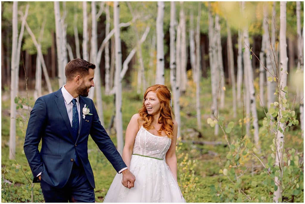 Fall elopement ceremony at Blue Sky Mountain Ranch in Blackhawk with bride wearing dress from BHLDN and designed by Watters.  Groom is wearing suit from Indochino. 