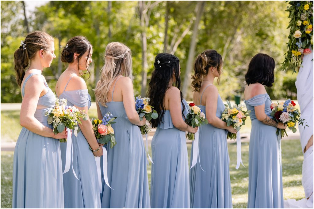 Bridesmaids watching ceremony at Columbine Country Club