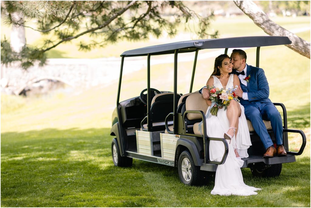 Bride and groom on golf cart at Columbine Country Club