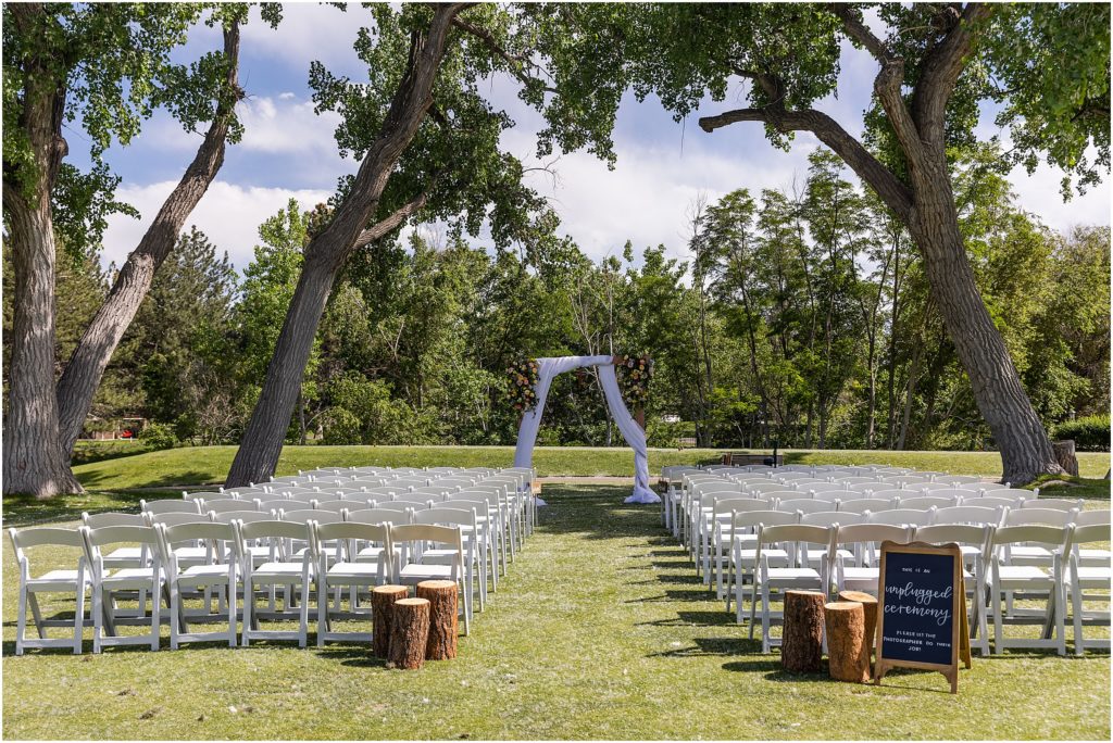 Guests seats and cotton trees at Columbine Country Club for summer June wedding in Colorado