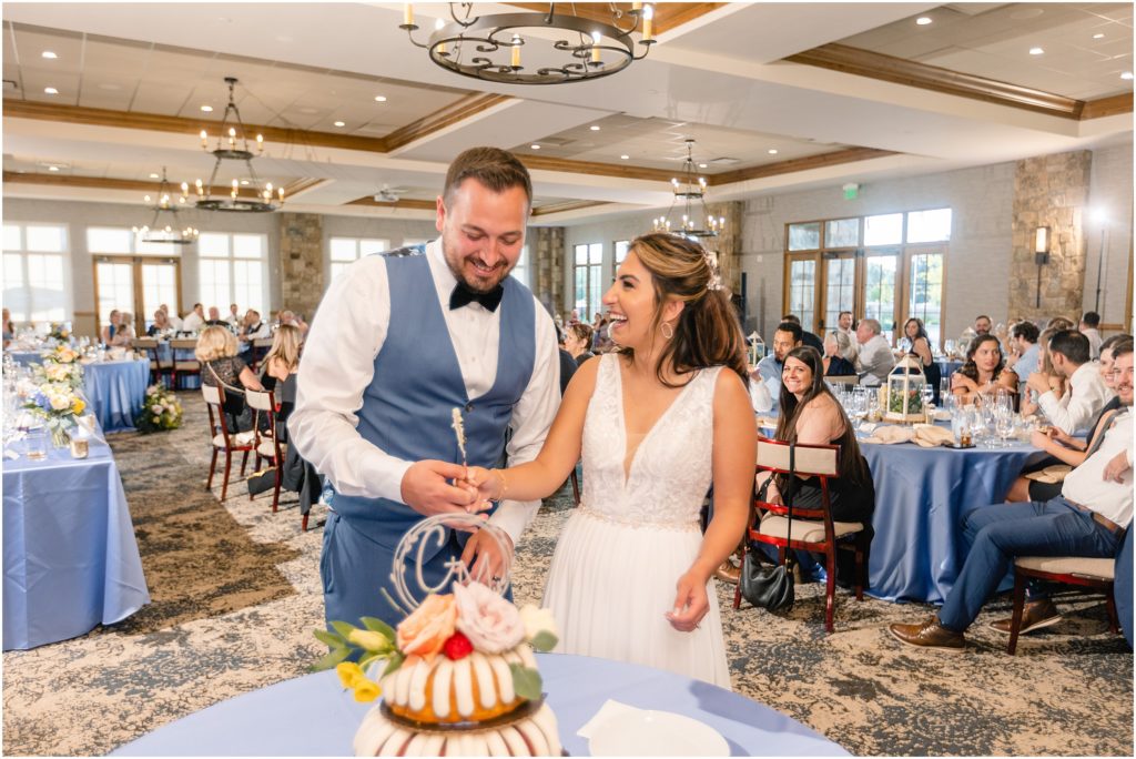 Bride and groom cutting wedding cake designed by Nothing Bundt Cakes at Columbine Country Club