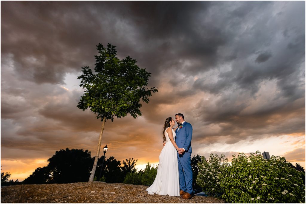 Bride and groom outside in the evening at Columbine Country Club