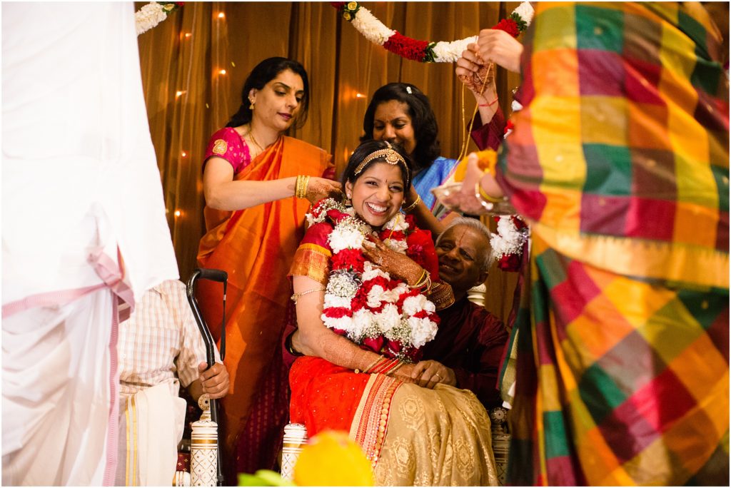Bride laughing during ceremony at The Hindu Temple and Cultural Center of the Rockies