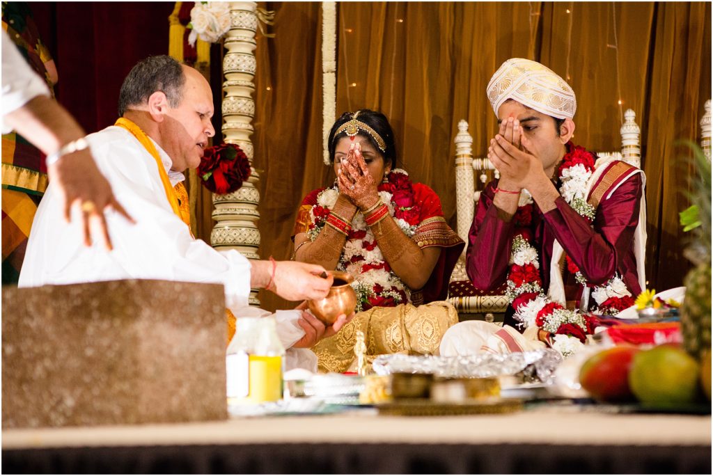 Bride and groom during ceremony at The Hindu Temple and Cultural Center of the Rockies