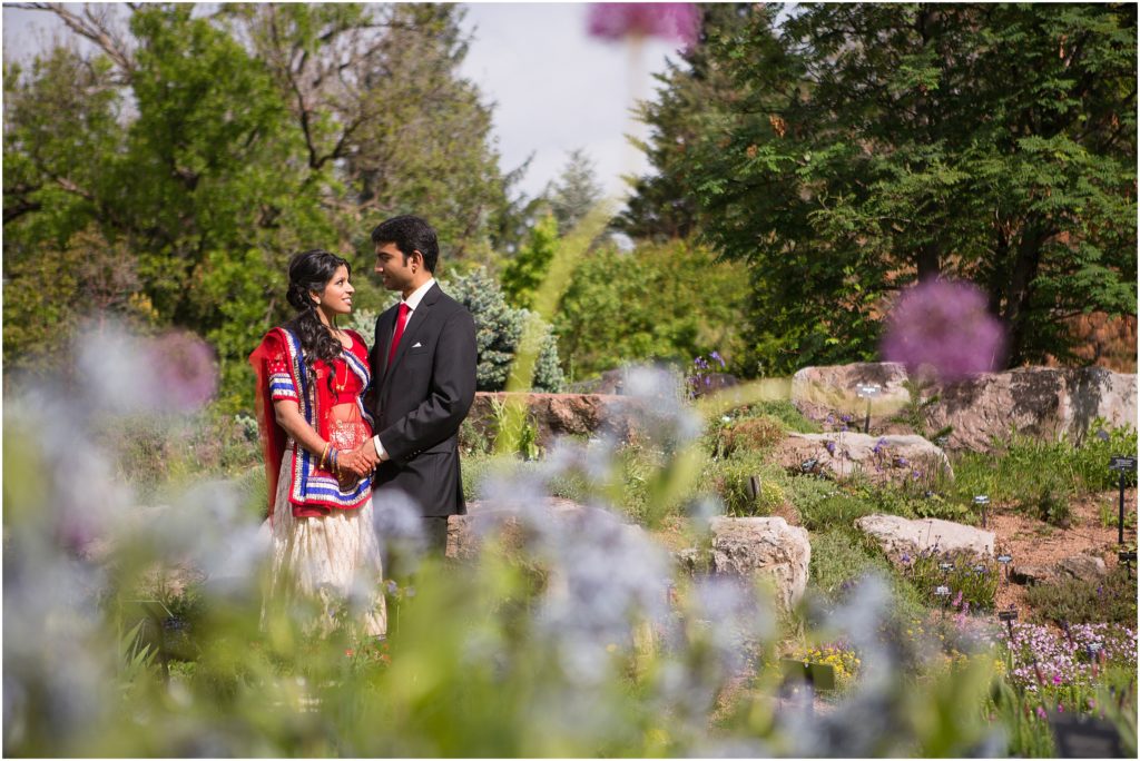 Bride and groom outside at Denver Botanic Gardens during Indian wedding reception
