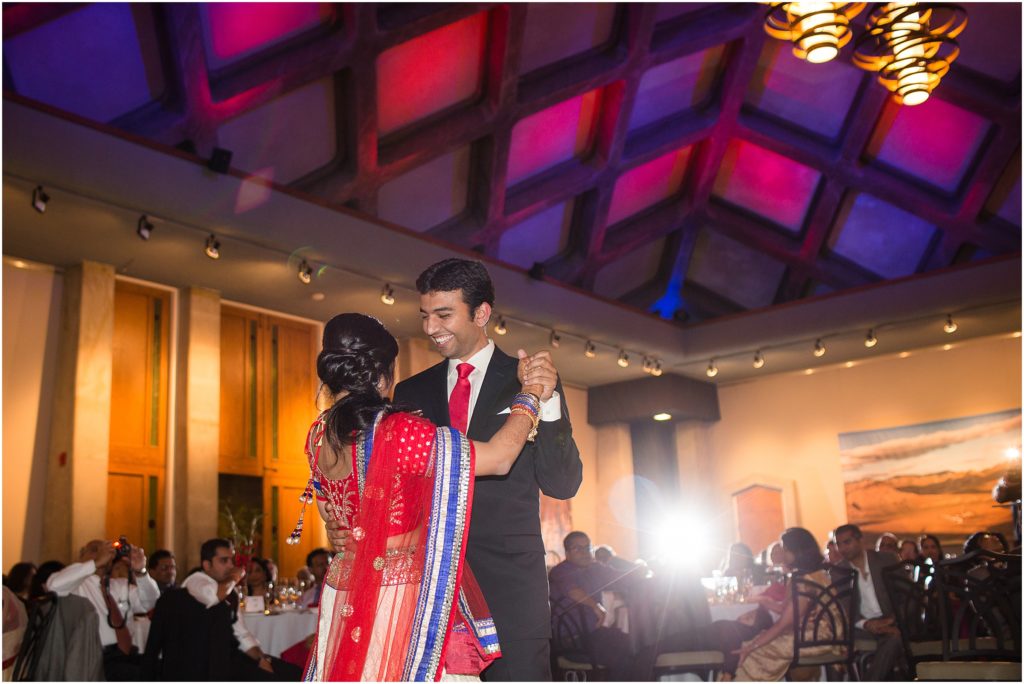 Bride and groom dance at Denver Botanic Gardens during Indian wedding reception