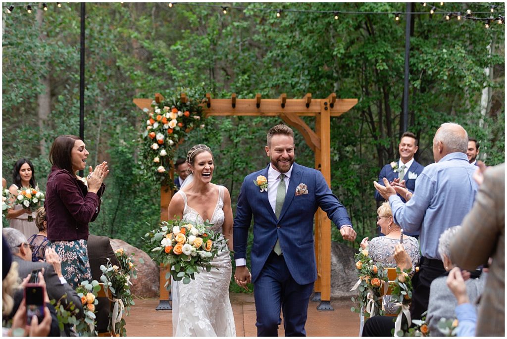 Bride and groom during wedding ceremony at Donovan Pavilion in Vail.