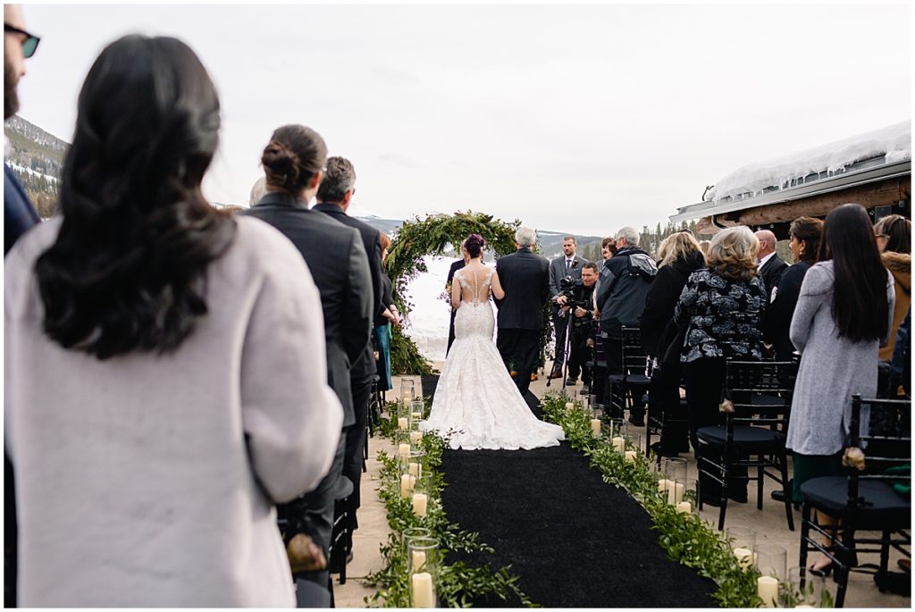 Father walking bride down for wedding at Keystone Ranch