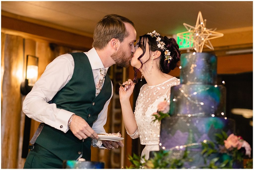 Bride and groom eating cake at Keystone Ranch