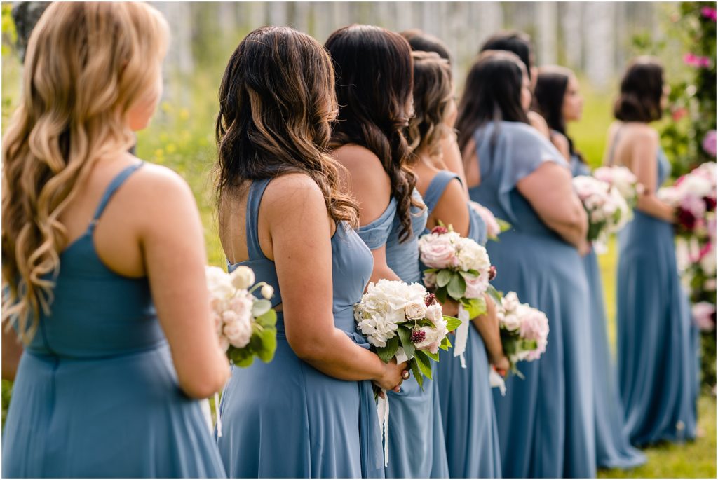 Bridesmaids watching ceremony at Flying Diamond Ranch in Steamboat Springs