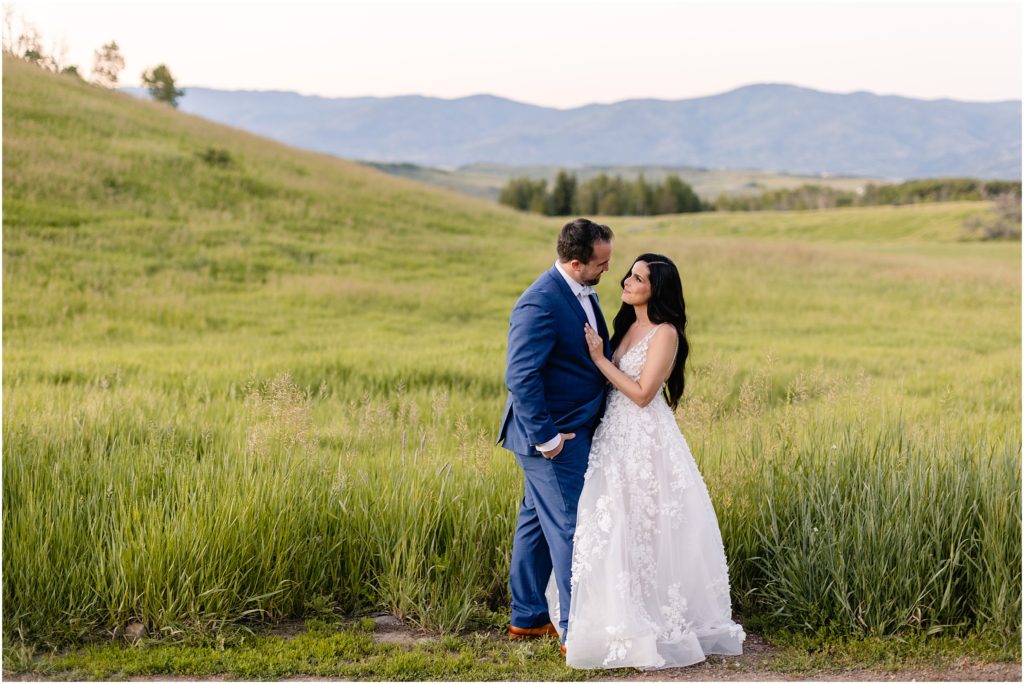 Bride and groom in open fields after wedding ceremony at Flying Diamond Ranch in Steamboat Springs
