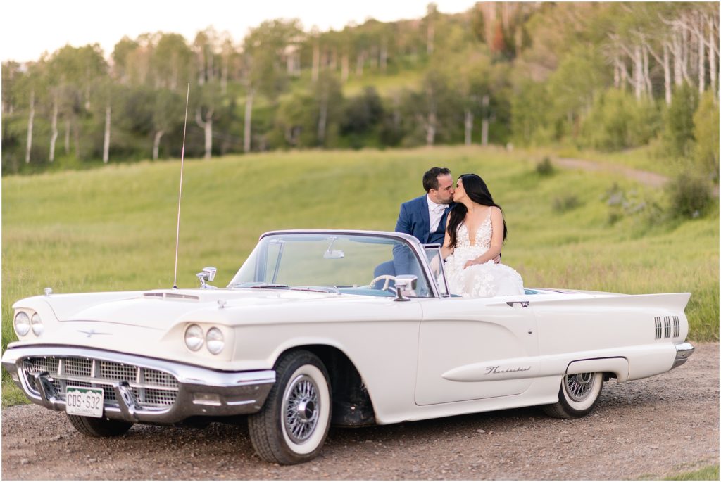 Bride and groom in car after wedding ceremony at Flying Diamond Ranch in Steamboat Springs