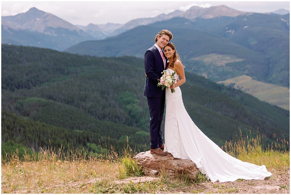 Bride and groom at top of Vail mountain