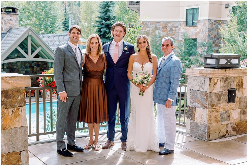 Bride and groom with family at Four Seasons Vail.