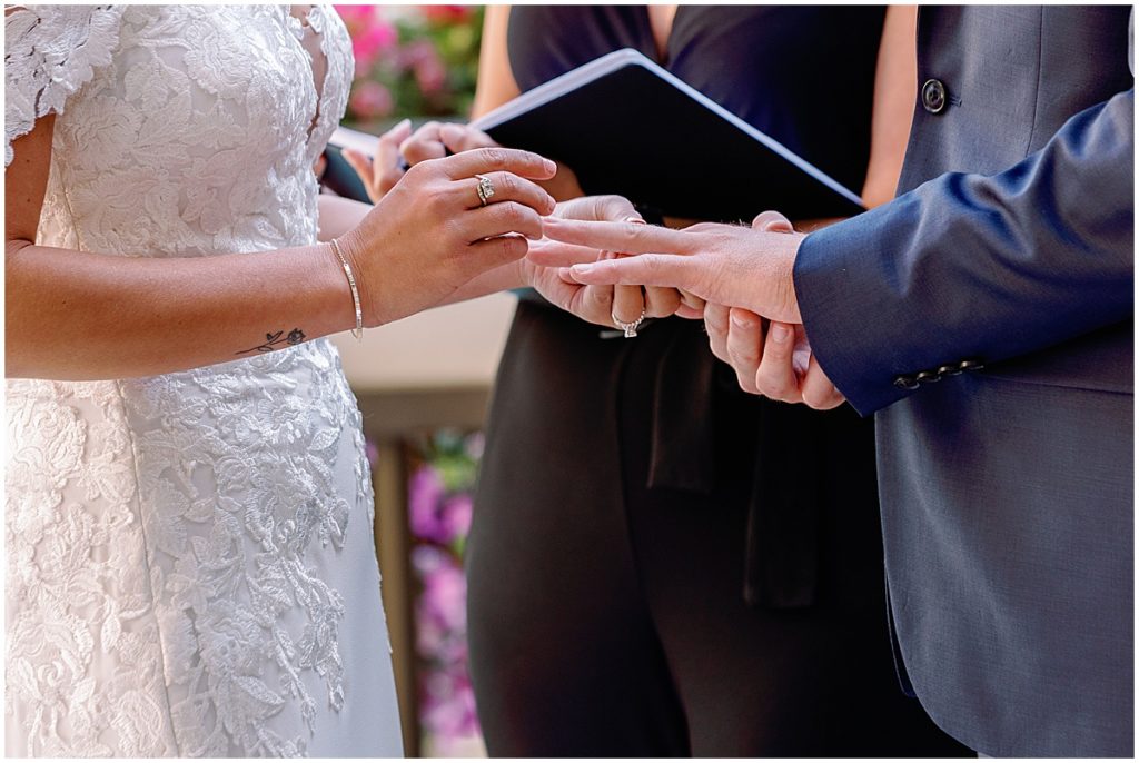 Bride and groom exchanging rings at Four Seasons Vail.