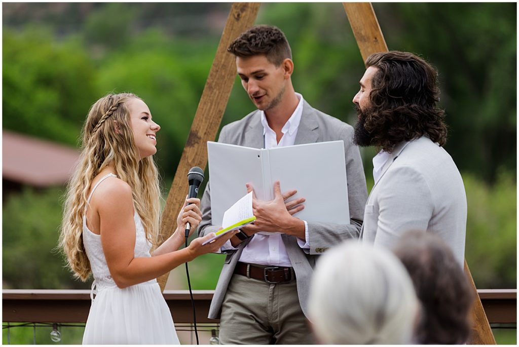 Bride and groom exchanging vows at 7 Castles Ranch