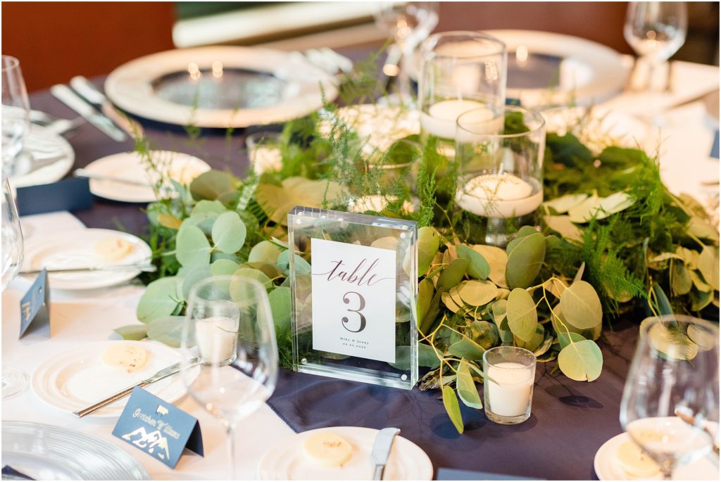 Reception table with rentals from Colorado Party Rentals and floral decor by Bustle and Bloom