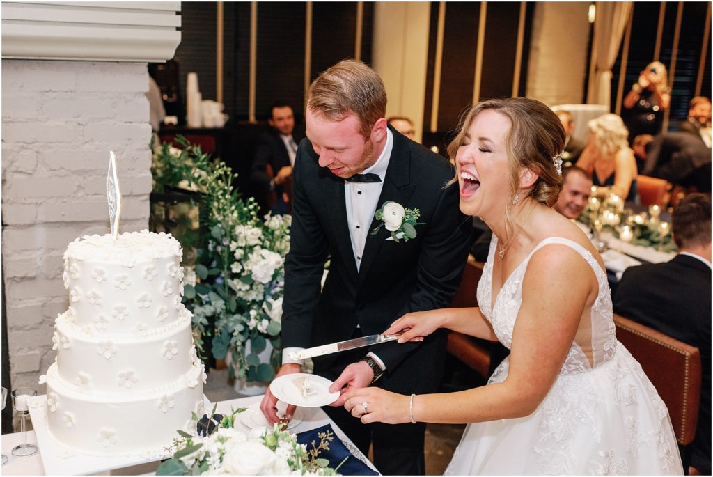 Bride and groom cutting cake designed by Mountain Flour