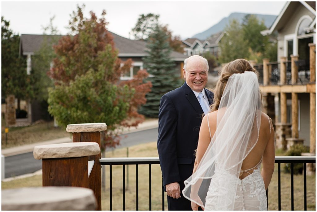 Bride wearing wedding dress from Town and Country Bridal meeting her dad