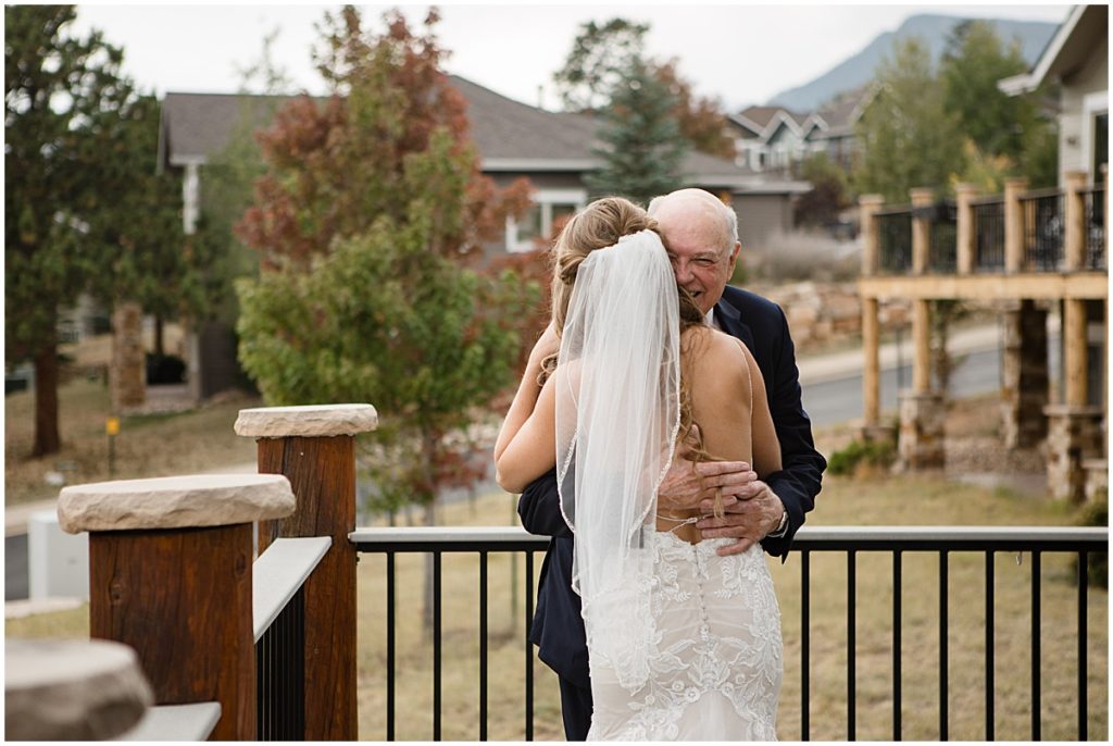 Bride wearing wedding dress from Town and Country Bridal meeting her dad