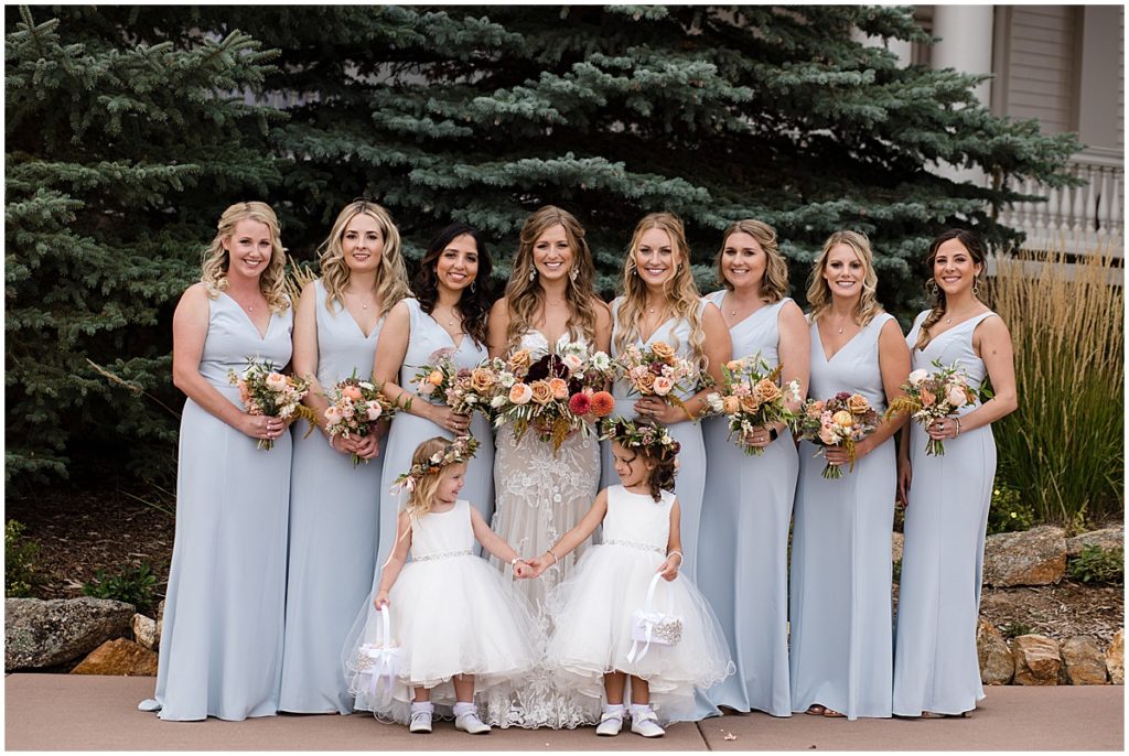 Bride wearing wedding dress from Town and Country Bridal and bridesmaids wearing dress from Amsale.  Floral decor by Lace and Lilies Flowers.