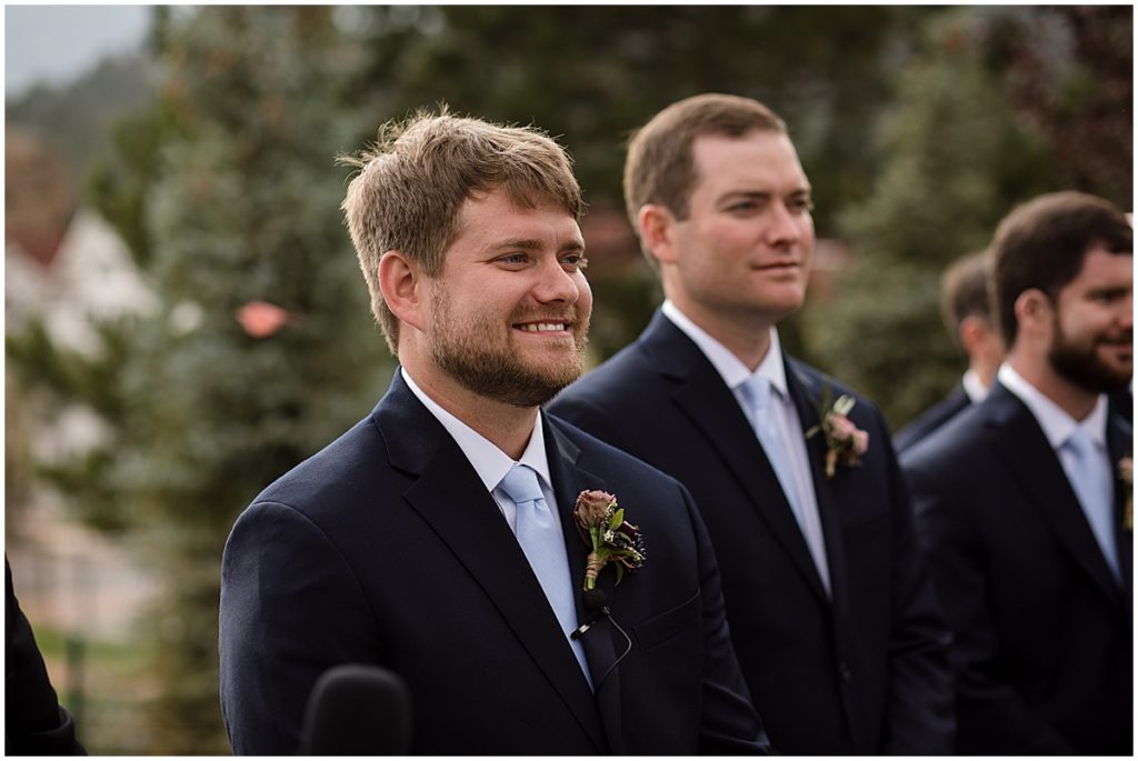 Groom wearing suit from Jos A Bank for wedding at the Stanley Hotel in Estes Park.