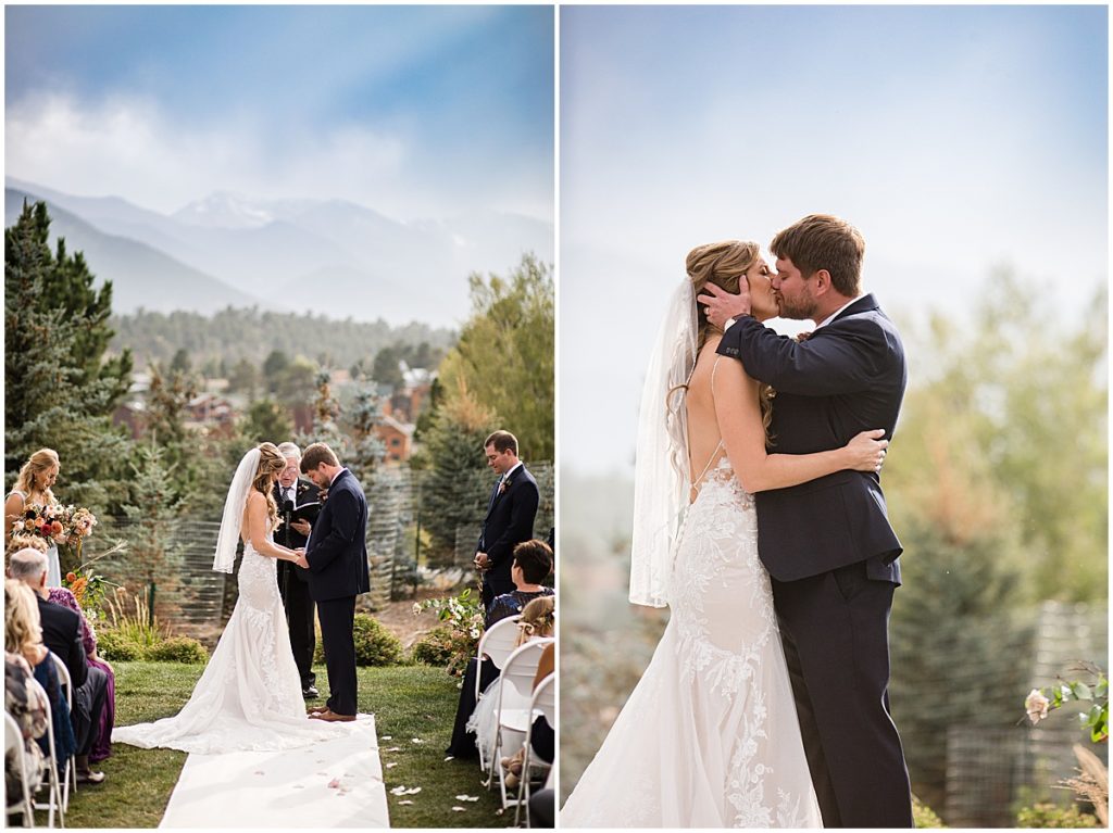 Bride and groom kiss during wedding ceremony at the Stanley Hotel in Estes Park.