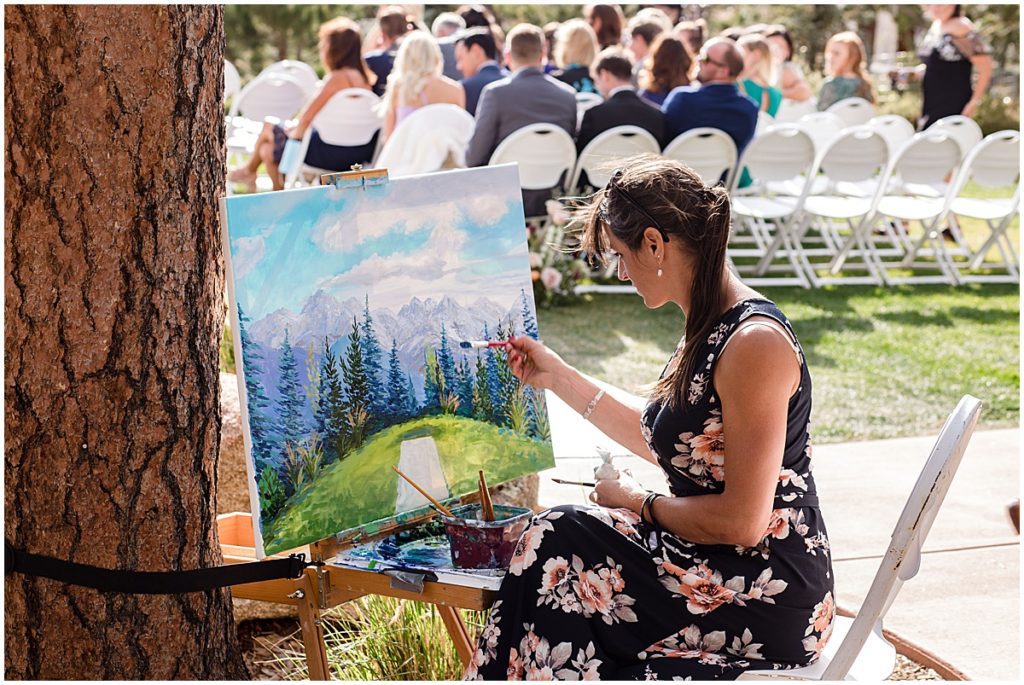 Live wedding painting by Julia Dordoni at the Stanley Hotel in Estes Park.