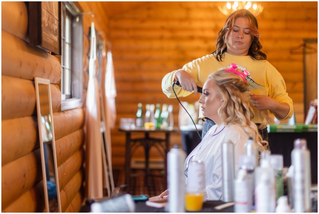 Bride getting ready at Grand Lake Lodge getting makeup done by Lux Salon and Studios