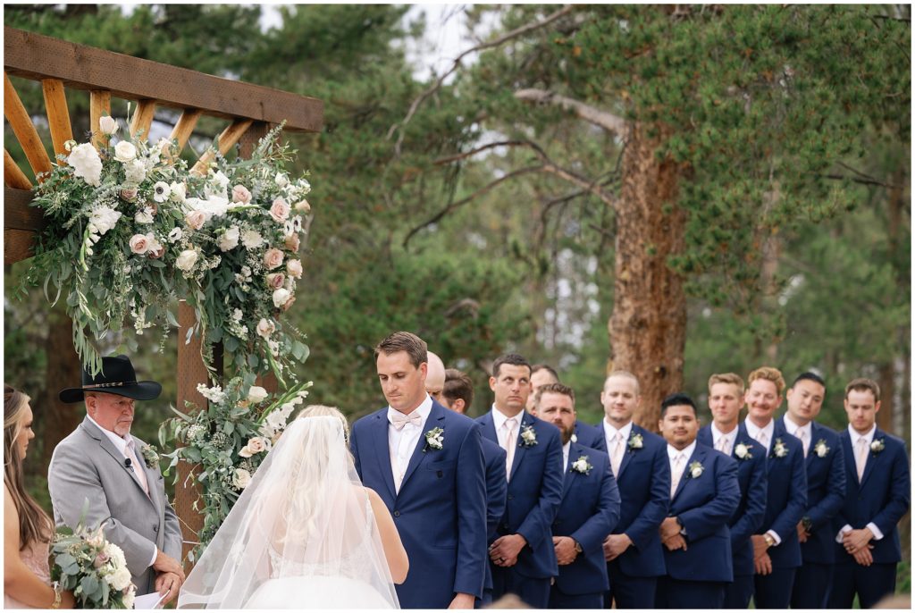 Bride reading vows to bride during ceremony at Grand Lake Lodge