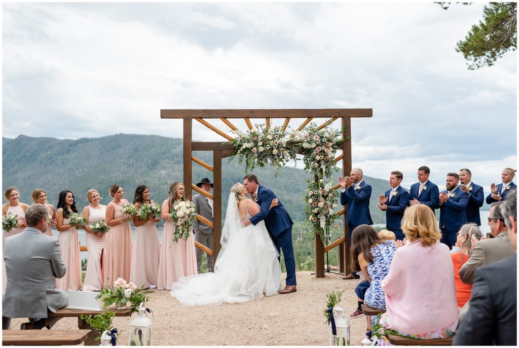 Bride and groom kiss at Grand Lake Lodge