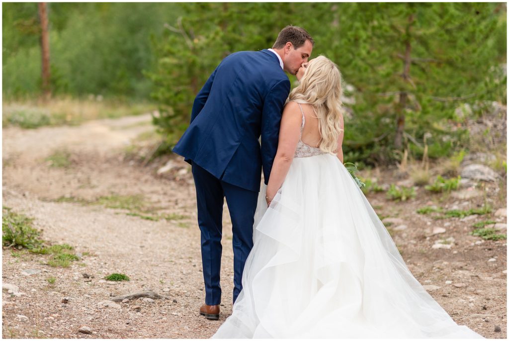 Bride and groom kissing after ceremony at Grand Lake Lodge