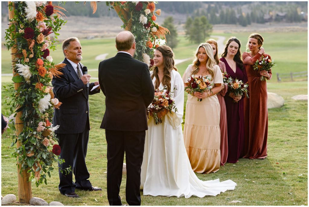 Officiant with bride and groom ceremony at Keystone Ranch
