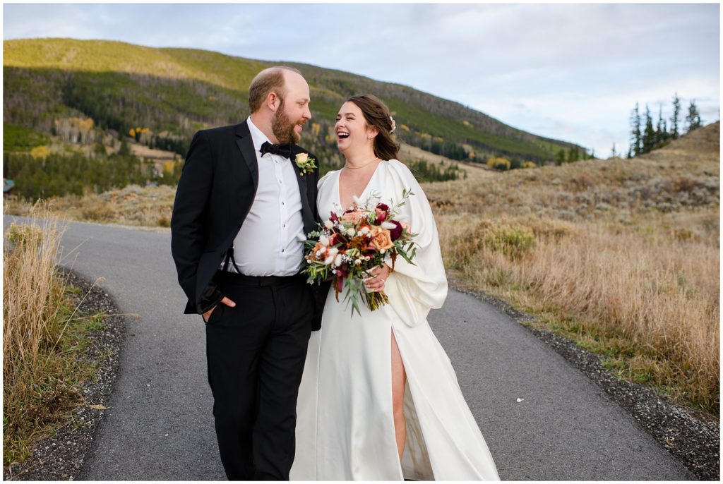 Bride and groom walkingoutside at Keystone Ranch