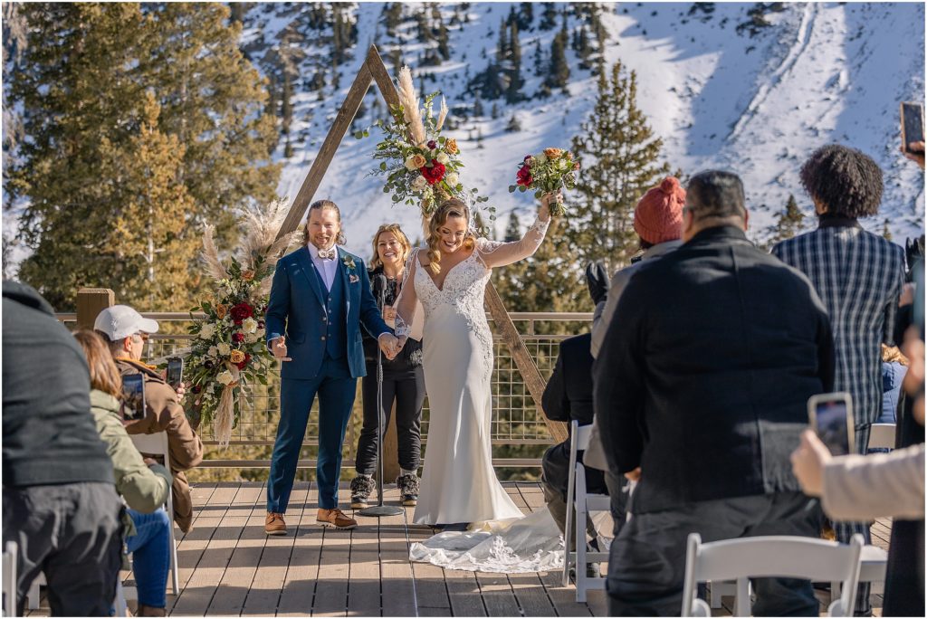 Bride and groom celebrate after ceremony at Arapahoe Basin.