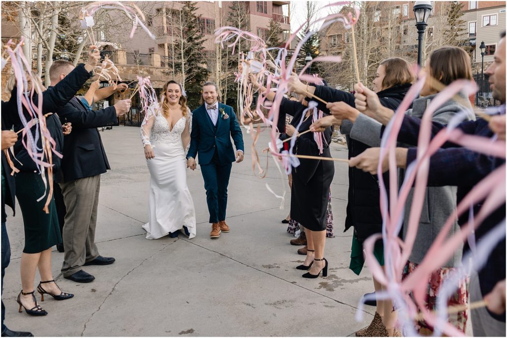 Bride and groom send off after reception outside quandary grill in Breckenridge