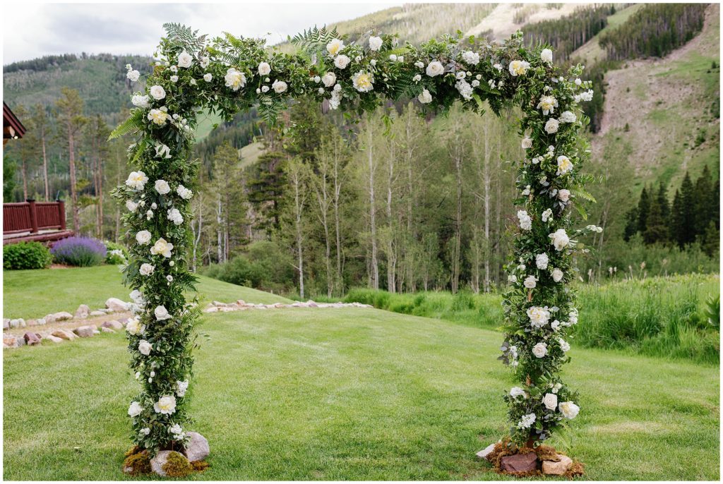 Ceremony arch designed by Rose Petals Vail at Beano's Cabin