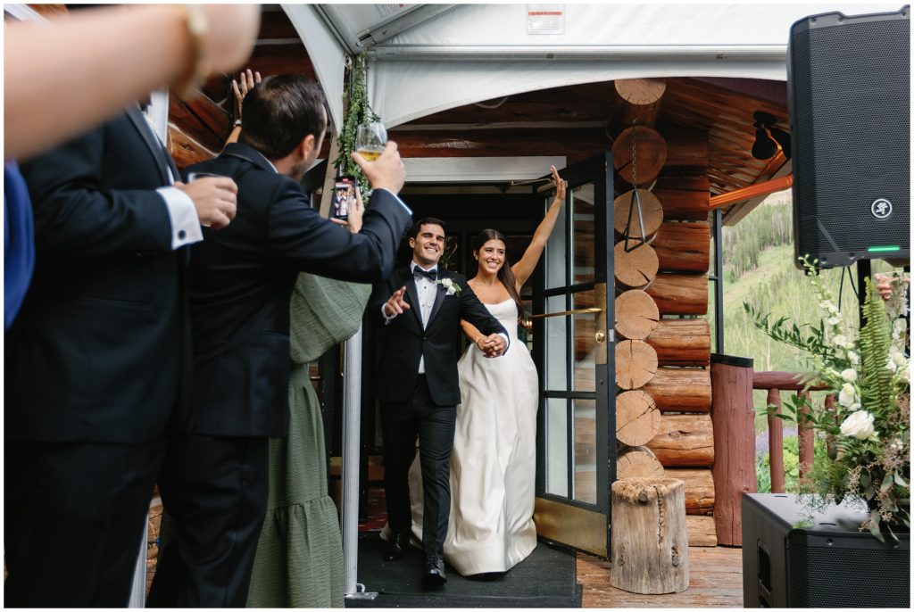 Bride and groom grand entrance at Beano's Cabin