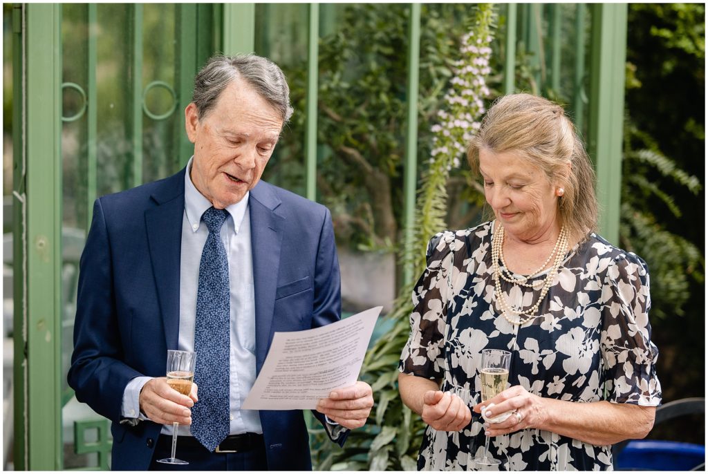 Parents giving speech at Denver Botanic Gardens during reception